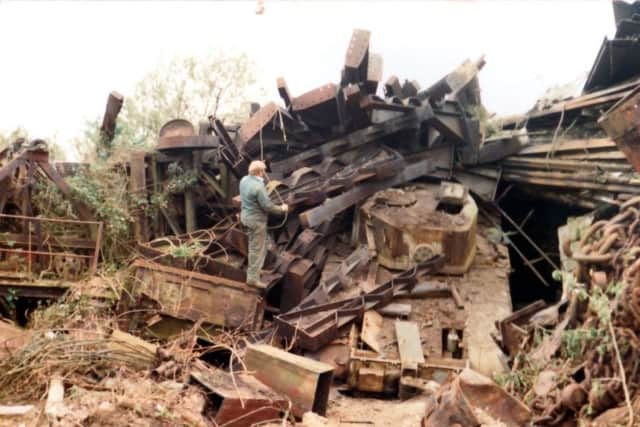 Roger Allen standing alongside one of the hidden tanks at Poundss scrapyard, Tipner, Portsmouth.