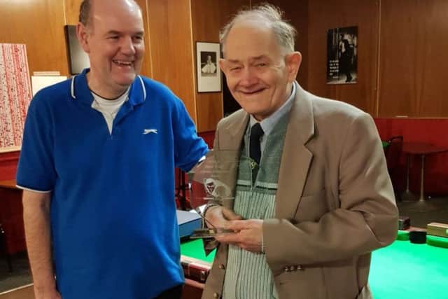 Peter Rook receives his award from John Wyatt