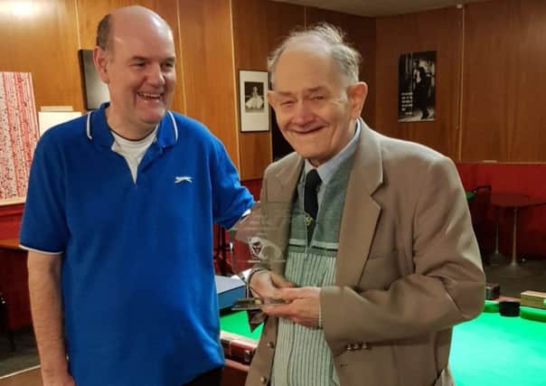 Peter Rook receives his award from John Wyatt