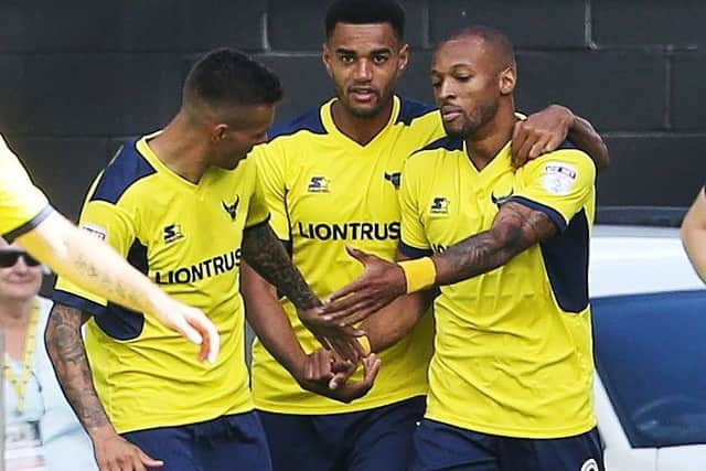 Wes Thomas, right, scored the opening goal in Oxfords 3-0 win over Pompey at the start of the season