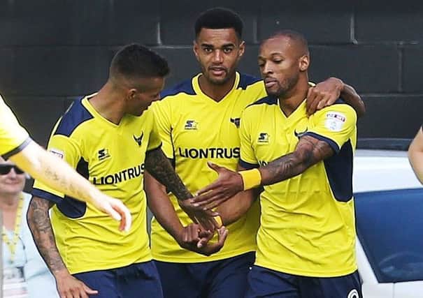 Wes Thomas, right, scored the opening goal in Oxfords 3-0 win over Pompey at the start of the season