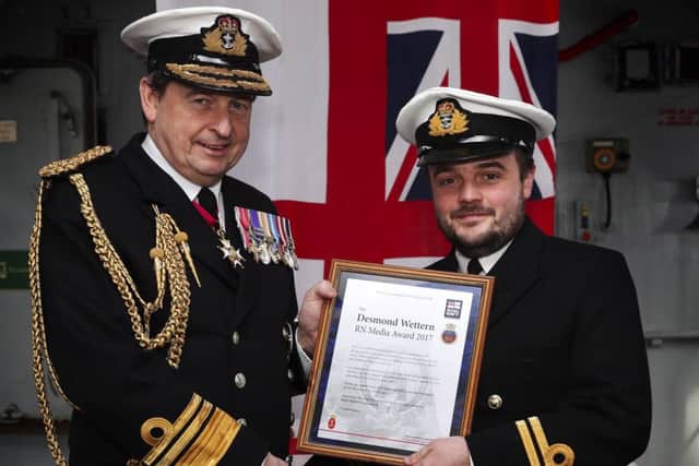 Pictured is (L-R) Second Sea Lord Vice Admiral Jonathan Woodcock presenting the Desmond Wettern award to Navigating Officer Lieutenant Greg Padden