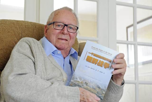 Jim Jacobs from Fareham has had his original book 'From The Imjin To The Hook' based on his experiences in The Korean War now translated into Chinese      Picture: Malcolm Wells (180312-0097)