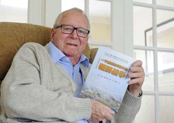 Jim Jacobs from Fareham has had his original book 'From The Imjin To The Hook' based on his experiences in The Korean War now translated into Chinese      Picture: Malcolm Wells (180312-0097)