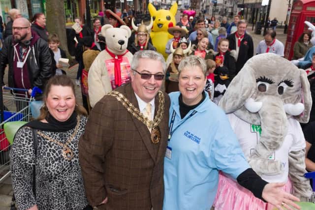 CATCH LINE: Mascot MarchDATE: 24-3-2018LOCATION: West Street, Fareham Shopping CentreSTORY: March of charity mascots through Fareham town centre to raise awareness of local charities - (L-R) Lady Mayoress Tina Fazackarley, Councillor Geoff Fazackarley (Mayor of Fareham), event organiser Hayley Hamlett, Marilyn White of 'One Community' lead off the mascot march.PICTURE: Duncan Shepherd PPP-180324-185634006