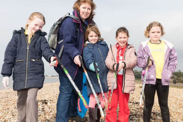 Mollie Hine, Emma Ansell, Heidi Cumming, Scarlet McKay, Tori Duggan from 7th Alverstoke Brownies taking part in the beach clean at Stokes Bay Picture: Keith Woodland