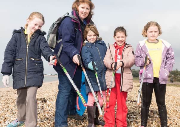 Mollie Hine, Emma Ansell, Heidi Cumming, Scarlet McKay, Tori Duggan from 7th Alverstoke Brownies taking part in the beach clean at Stokes Bay     Picture: Keith Woodland