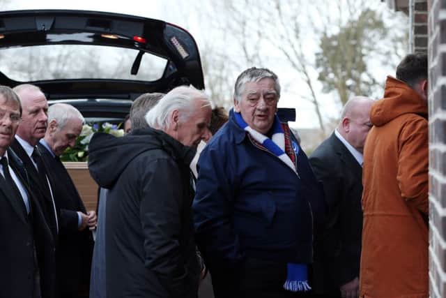 Mourners file past the coffin on their way into the chapel.   Picture: Chris Moorhouse