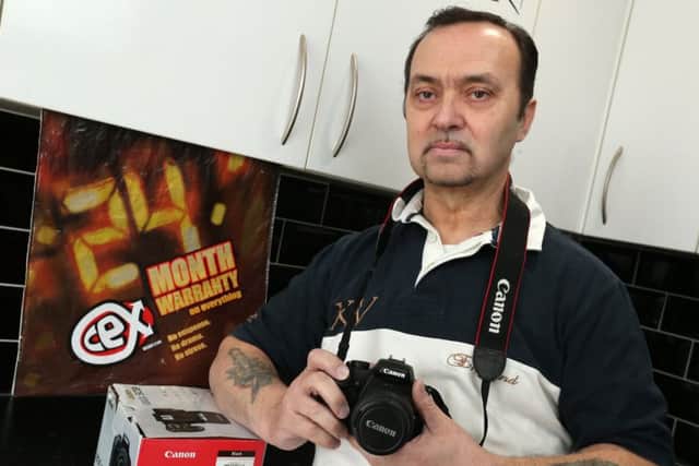 Fred Bright of Paulsgrove, who found that the CeX shop from where he bought this used Canon DSLR will not honour its no-quibble guarantee for an exchange       Picture: Chris Moorhouse