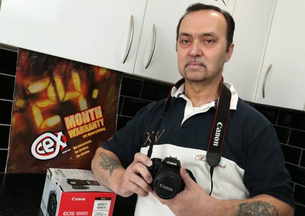 Fred Bright of Paulsgrove, who found that the CeX shop from where he bought this used Canon DSLR will not honour its no-quibble guarantee for an exchange       Picture: Chris Moorhouse