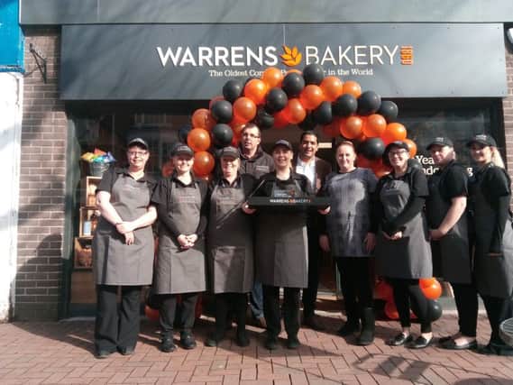 Ali Rupani, middle, with the staff at the new Warrens Bakery in Gosport High Street. Picture: David George PPP-180703-115303001