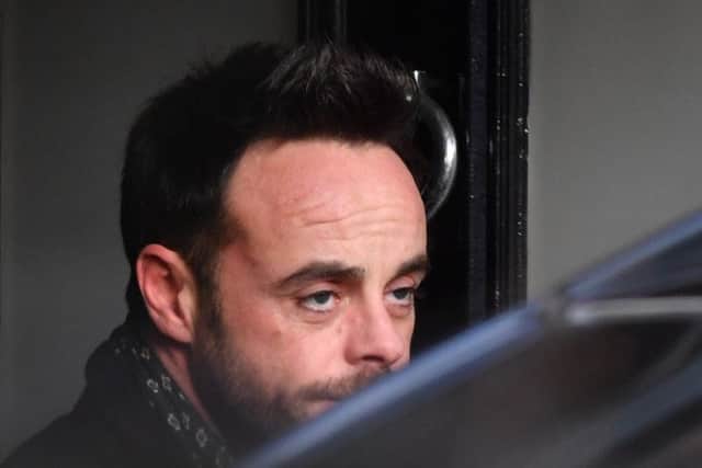 Ant McPartlin leaving a house in west London after he was interviewed by police on suspicion of drink-driving
