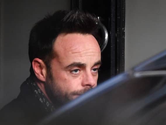 Ant McPartlin leaving a house in west London after he was interviewed by police on suspicion of drink-driving