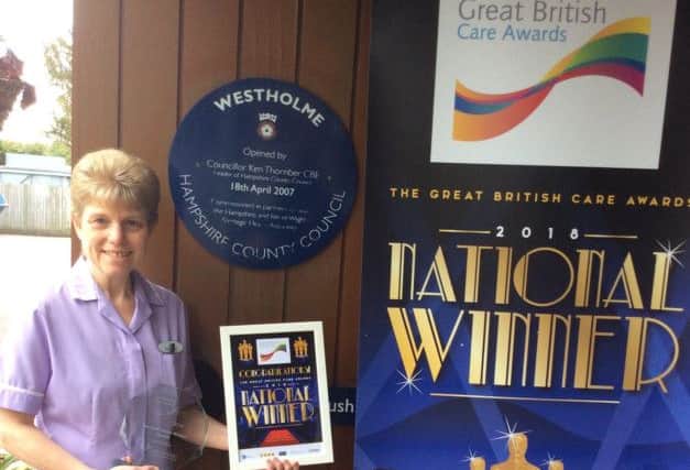 Gill Clements, care assistant at Westholme Residential and Nursing Home with her award. Picture: Supplied