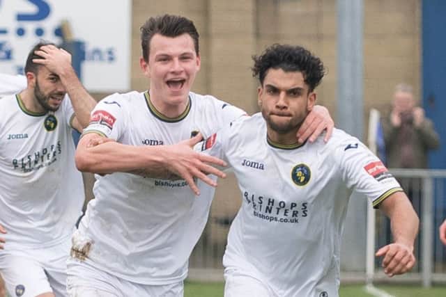 Theo Lewis, right, scored late on at Twerton Park to keep the Hawks top of the table Picture: Keith Woodland