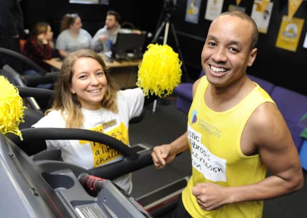 Former Great British Bake-off contestant Enwezor Nzegwu takes part in a 24-hour treadmill relay at Portsmouth University to raise money for cystic fibrosis. Fellow participant Dannii Hutchins gives support. 
Picture by Ian Hargreaves  (180224-1) PPP-180315-161657006