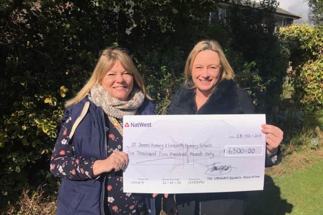 Emsworth Primary School headteacher Kate Fripp and St James' Primary School headteacher Erika Biddlecombe presented with the EBA cheque. Credit: Emsworth Business Association