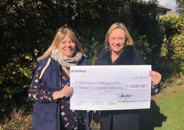 Emsworth Primary School headteacher Kate Fripp and St James' Primary School headteacher Erika Biddlecombe presented with the EBA cheque. Credit: Emsworth Business Association