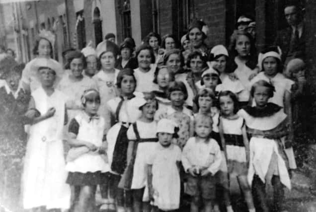 A coronation street party in Common Street, Landport, Portsmouth, in 1937. Audrey Blunn is bottom right.