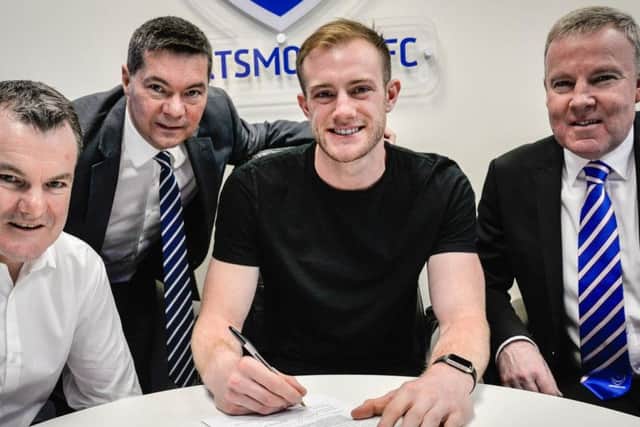 Pompey's Matt Clarke signs a new deal earlier this season. Picture: Colin Farmery/Portsmouth FC