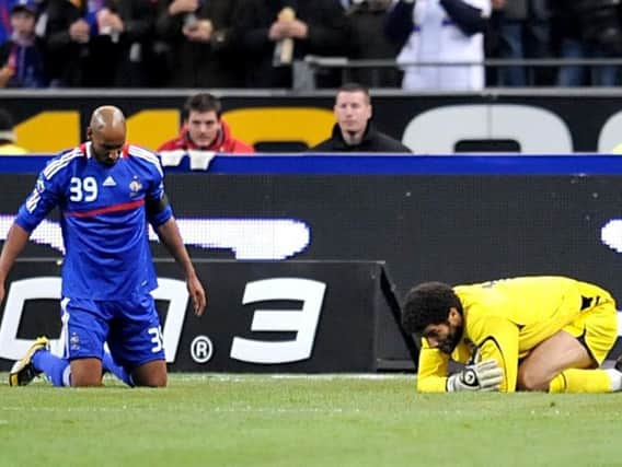 England goalkeeper David James and France's Nicolas Anelka lie on the ground after David James gave awayt a penalty