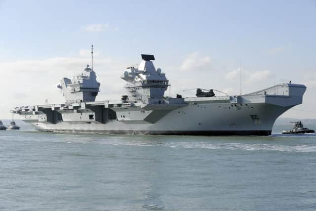 HMS Queen Elizabeth makes her way into Portsmouth Harbour. Picture: Malcolm Wells