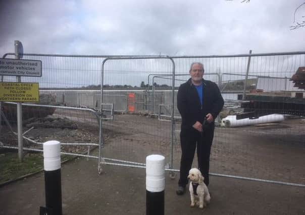 Robert Parker, of Barham Way, Portsmouth, says flood defence work is necessary at the coastal footpath in Tipner     

Picture: Steve Deeks
