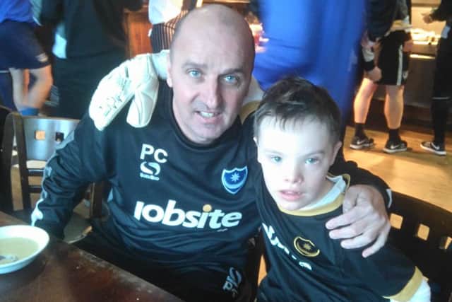 Former Pompey boss Paul Cook with young Blues fan Sam Ford