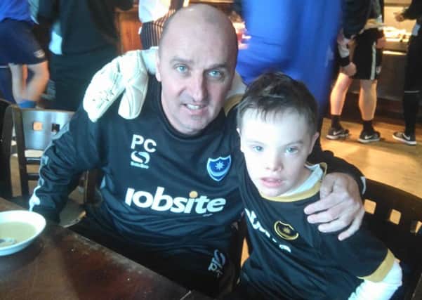 Former Pompey boss Paul Cook with young Blues fan Sam Ford