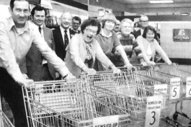 Contestants line-up at the Elm Grove, Hayling Island, Co-Op for The News-Co-Op trolley dash. From left, S Slade, of Portsmouth, M O'Connor, of Southsea, G Perryman, of Clanfield, V Gibson of Titchfield, E Jackson, of Portchester, and J Jones, of Hayling Island
