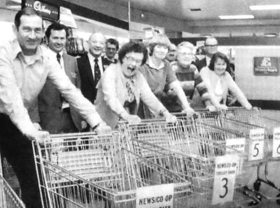 Contestants line-up at the Elm Grove, Hayling Island, Co-Op for The News-Co-Op trolley dash. From left, S Slade, of Portsmouth, M O'Connor, of Southsea, G Perryman, of Clanfield, V Gibson of Titchfield, E Jackson, of Portchester, and J Jones, of Hayling Island