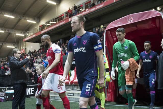 Matt Clarke leads Pompey out at Fleetwood.