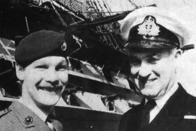 Marine Derek Tomsett, left, pictured with the captain of HMS Victory Lt Cmdr Charles Addis