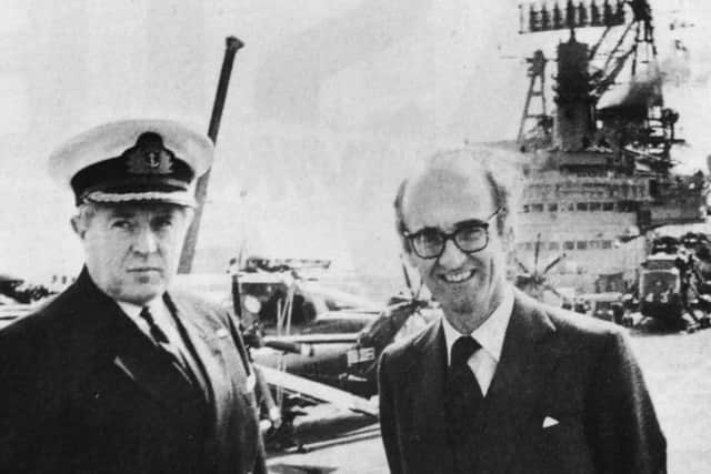 Defence secretary John Nott with the captain of HMS Hermes, Capt Lyn Middleton pictured at the top of the Harrier jet ski-ramp at the bow of the aircraft carrier during the ministers visit to Portsmouth Naval Base