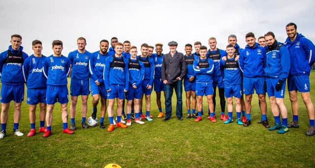 Hero Steve Chamberlain (centre) met the Pompey squad during their training session on Friday