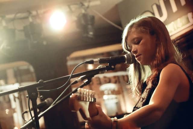 Erin Gracie playing at a concert