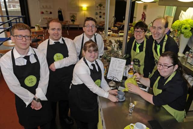 Adults with learning difficulties have been given the chance to work at the Lily and Lime cafe in the Central Library, Portsmouth (from left) Matthew Rimmer, Michael Lingley, Daniel Donovan, Lena Eldridge, Sarah White, Kevin Skilton and Louisa Edwards. Picture by Ian Hargreaves