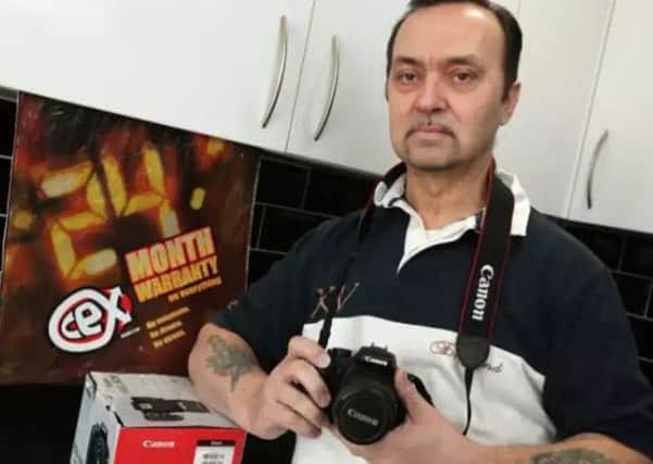Fred Bright of Paulsgrove, who found that the CeX shop from where he bought this used Canon DSLR will not honour its no-quibble guarantee for an exchange Picture: Chris Moorhouse