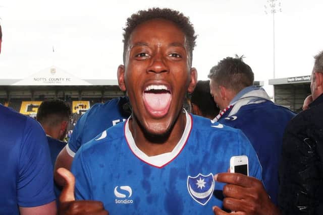 Jamal Lowe celebrates Pompey's promotion at Notts County last season
