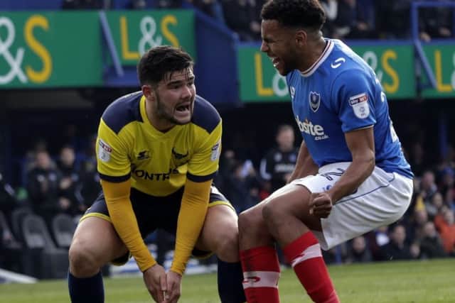 Nathan Thompson, right, confronts Oxford's Alex Mowatt Picture: Barry Zee