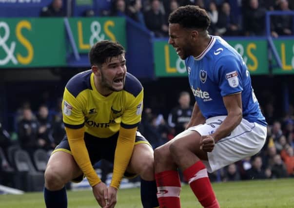 Nathan Thompson, right, confronts Oxford's Alex Mowatt Picture: Barry Zee