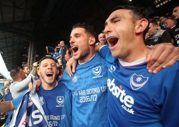 Gary Roberts, right, celebrates Pompey's League Two title triumph on the final day of last season. Picture: Joe Pepler