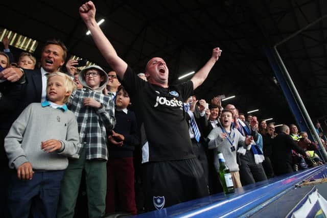Paul Cook celebrates winning the League Two title at Pompey. Picture: Joe Pepler