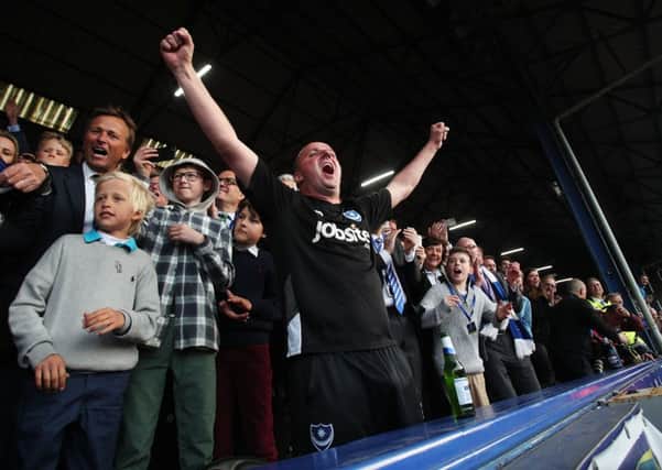 Paul Cook celebrates winning the League Two title at Pompey. Picture: Joe Pepler