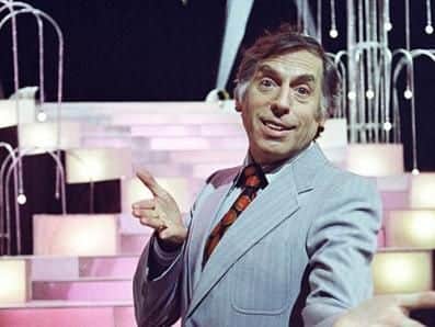 Go behind the door with Larry Grayson.