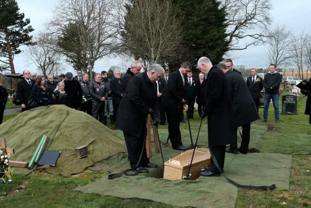 Mr Daniels' coffin is laid in the ground   Picture: Chris Moorhouse