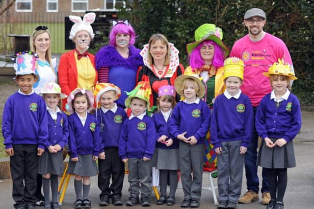Pupils and staff at Padnell Infant School in Cowplain with Tim Green from Brain Tumour Research, back row, right Picture: Malcolm Wells (180329-9176)