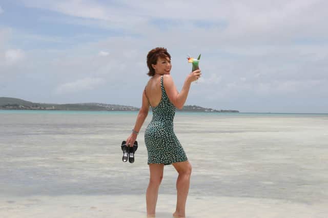 Katy Lette enjoys a cocktail on the beach