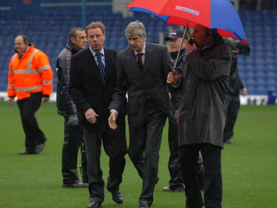 Harry Redknapp and Arsene Wenger inspect the pitch at Fratton Park