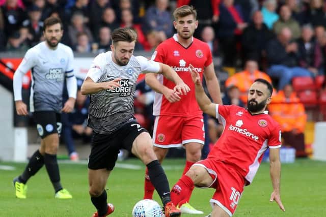 Erhun Oztumer, right, in action against Peterborough earlier this season